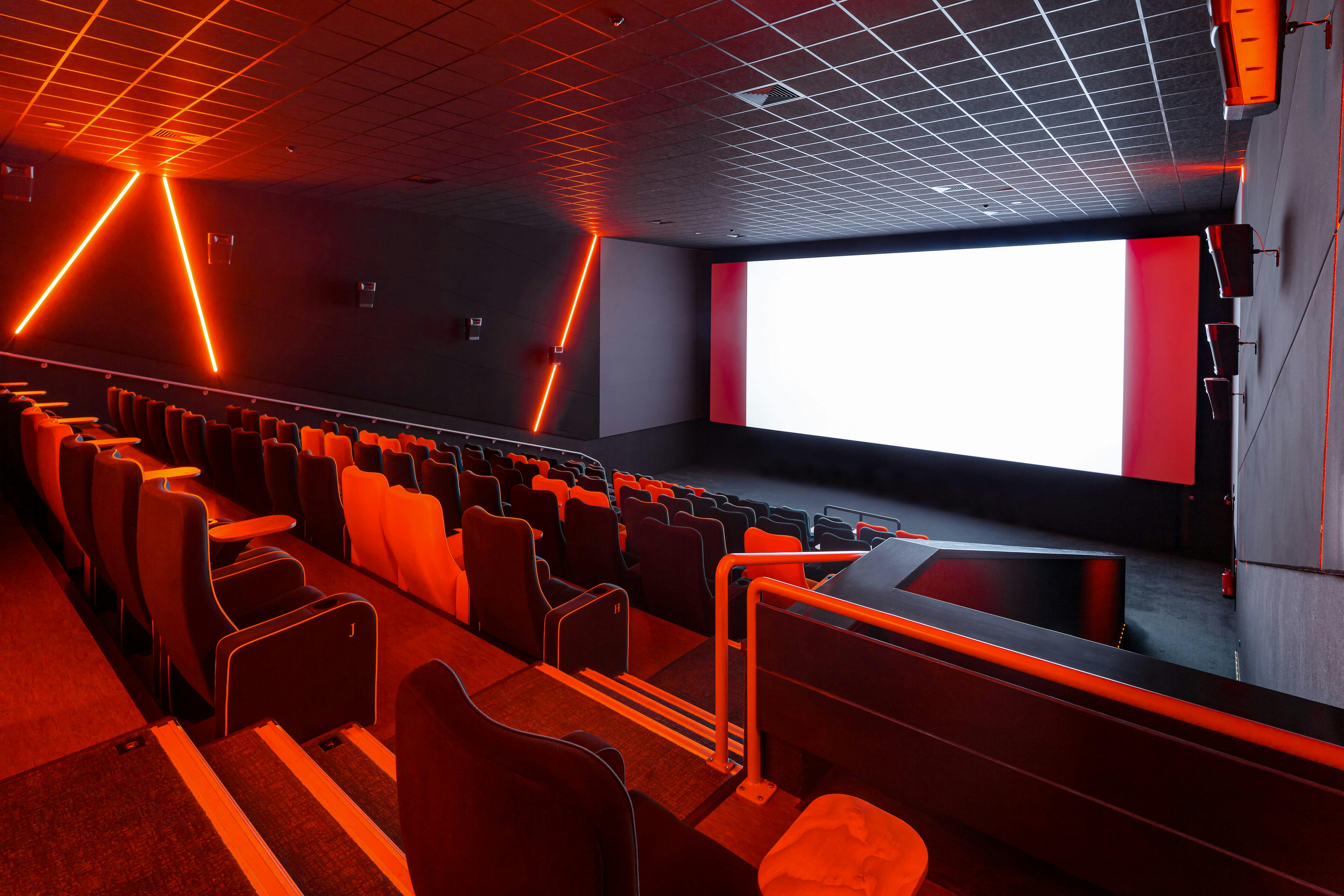 Modern cinema auditorium with sleek seating for film screenings and corporate events.