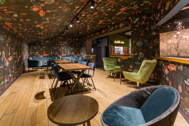 Atlantis Room at The Light Cinema Stockport, featuring floral wallpaper for meetings and events.