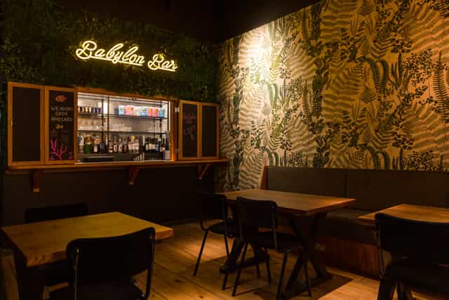 Babylon Bar at The Light Cinema Stockport, vibrant tropical decor for networking events.