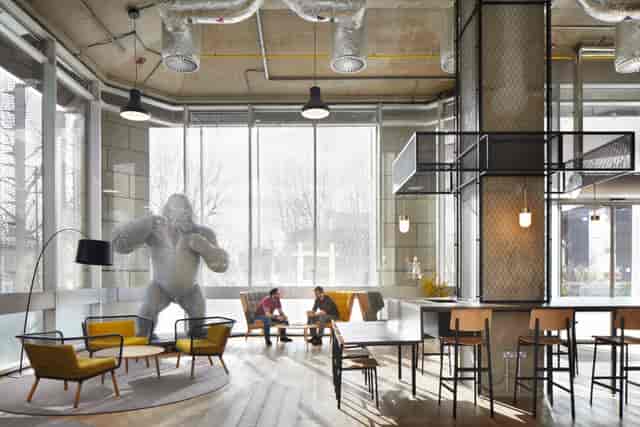 Modern open-concept meeting space with natural light for creative events and brainstorming.