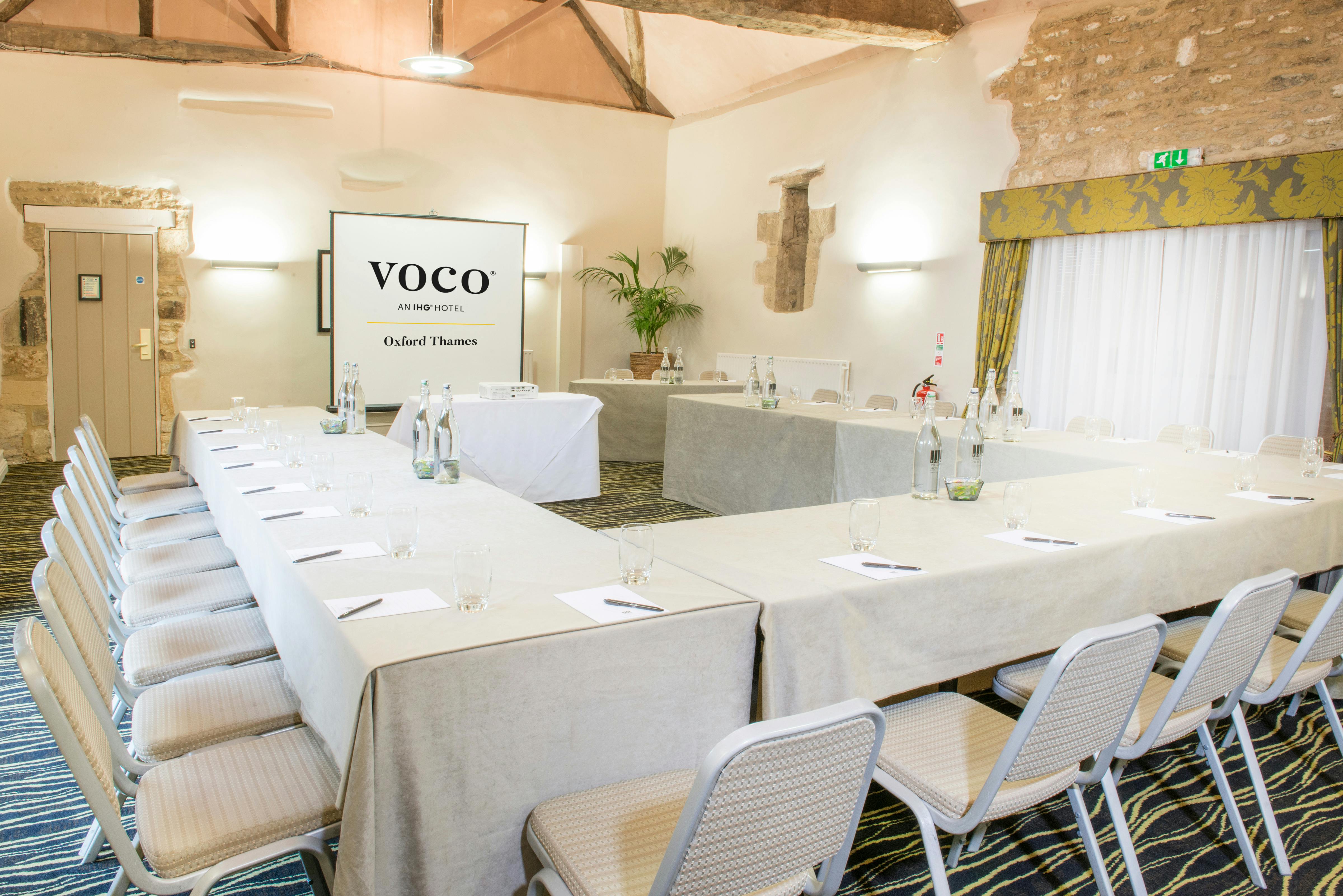 Little Barn meeting room at voco™ Oxford Thames, U-shape setup for productive events.