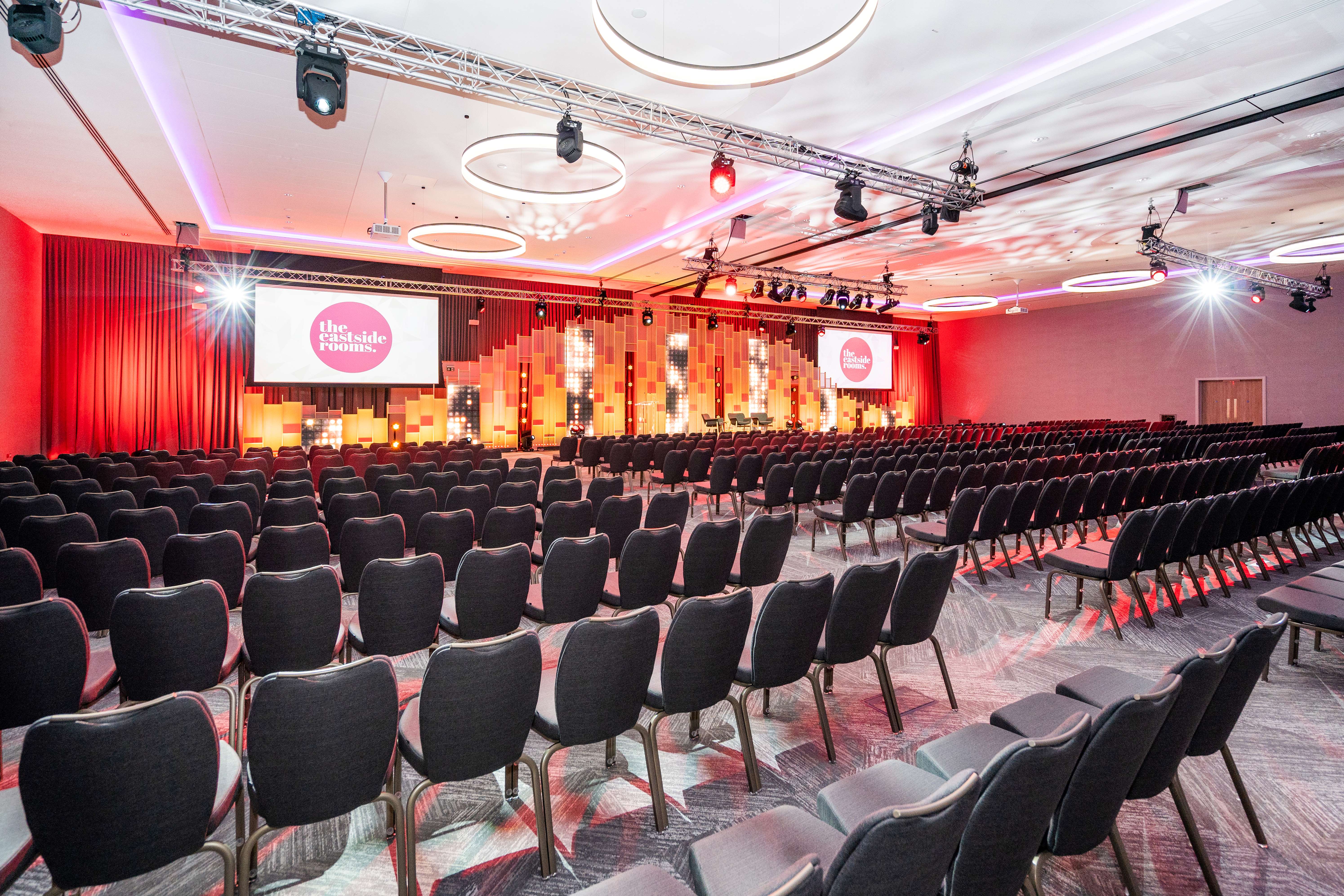 Affinity Suite event space with seating for conferences and presentations. - Banner