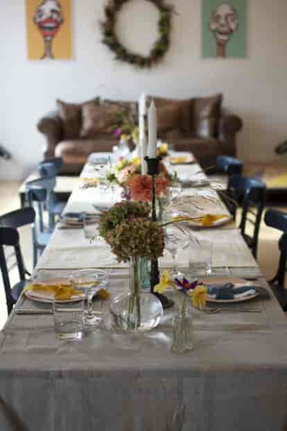 Cozy event space in Streatham with floral centerpiece, perfect for networking and celebrations.