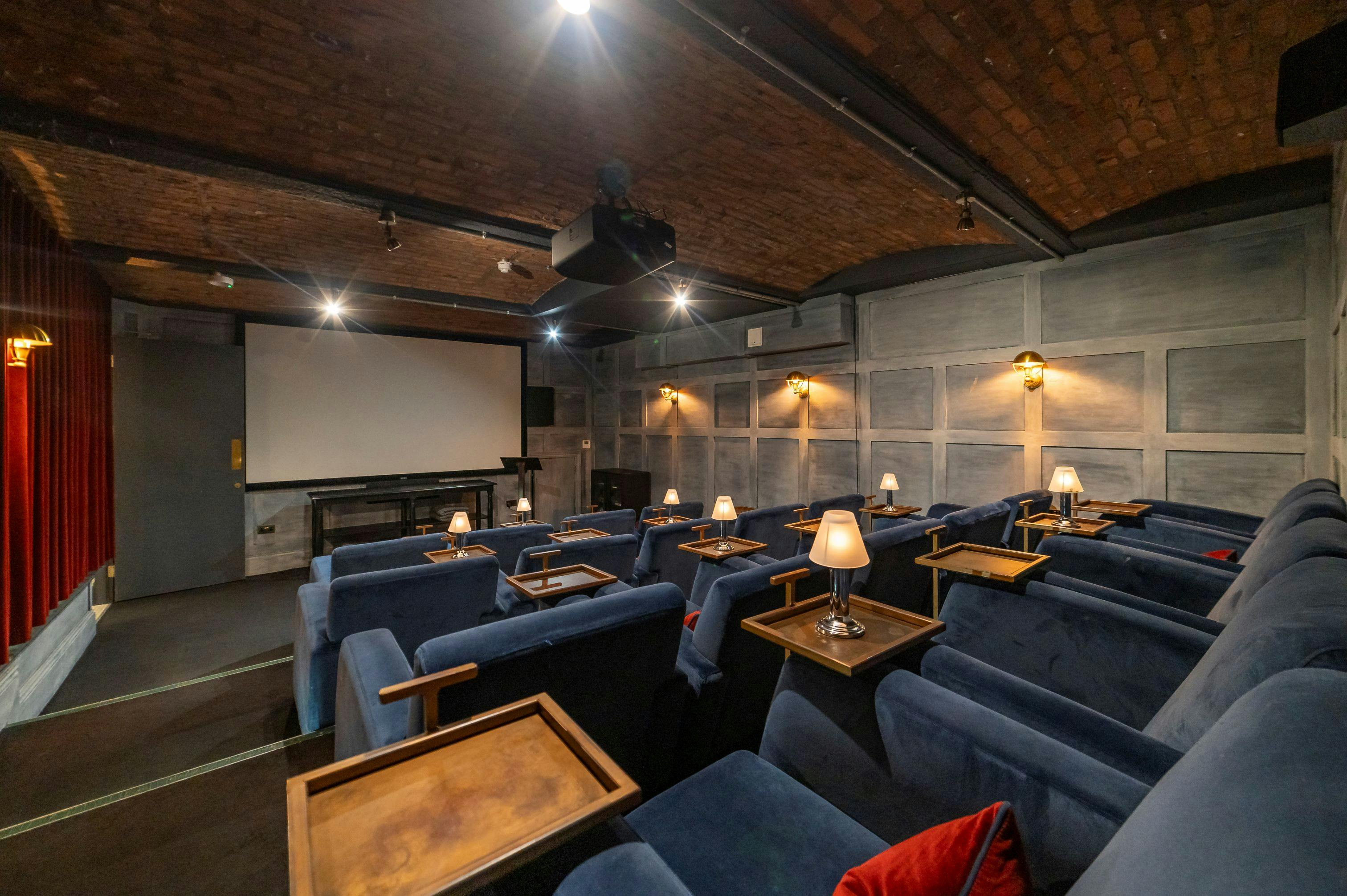 Cozy screening room with plush seating for private film events at King Street Townhouse.