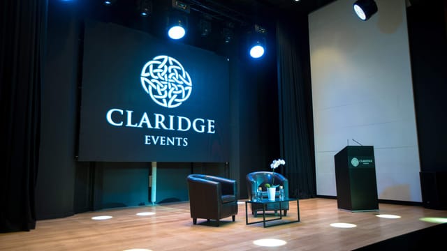 Claridge Events stage setup with professional lighting for presentations and meetings.