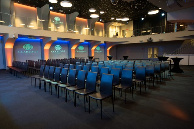 Event space at Claridge with modern lighting, ideal for conferences and presentations.