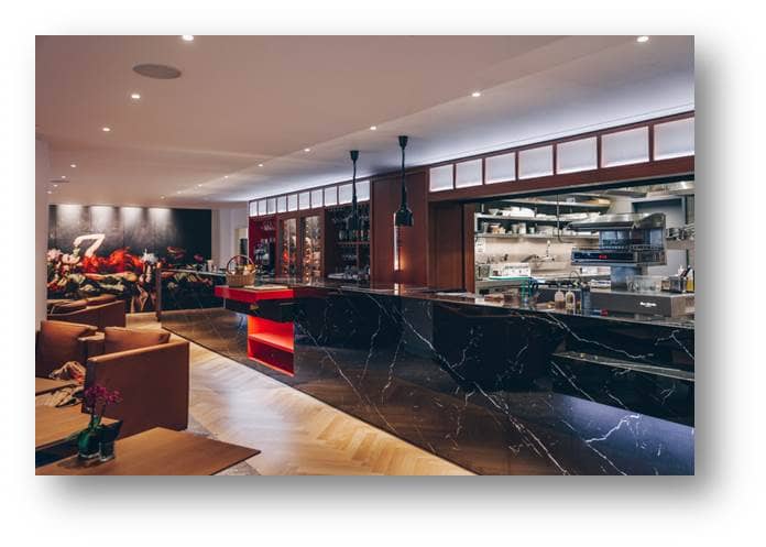 Sleek event space at Sofitel Brussels with marble bar, perfect for corporate gatherings.