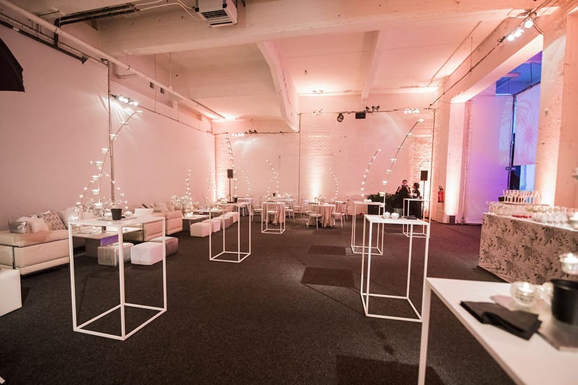 Versatile event space with minimalist decor, ideal for networking and social events.