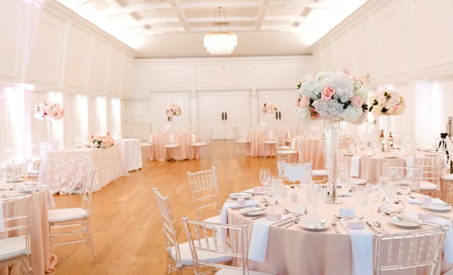 Elegant Lord Stanley Ballroom with floral centerpieces, ideal for weddings and upscale events.