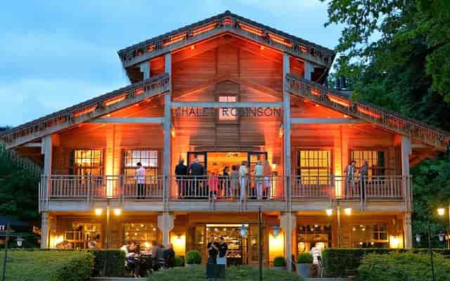Chalet Robinson venue with rustic wooden architecture, perfect for events and celebrations.