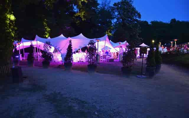 Elegant outdoor event space at Chalet Robinson with purple lighting for receptions.