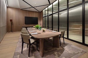 Modern meeting room at Tate Britain, featuring a sleek wooden table for professional events.