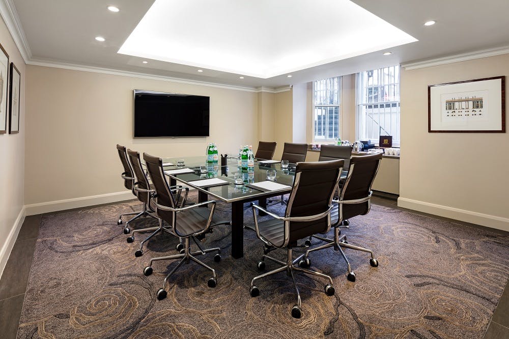 Modern conference room with glass table at Radisson Blu Hotel, London South Kensington.