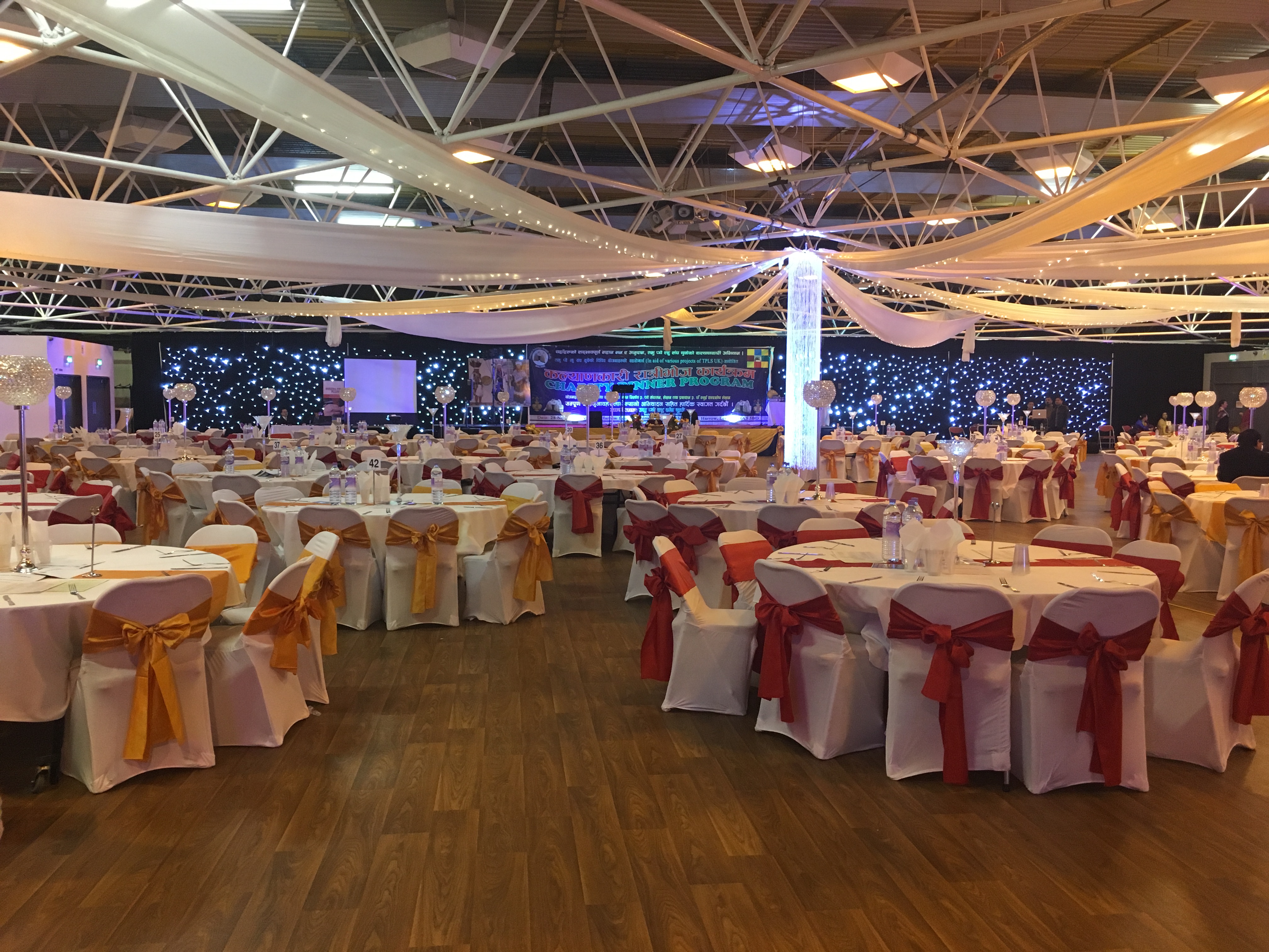 Elegant event space in Byron Hall with festive table settings for weddings and corporate functions. - Banner