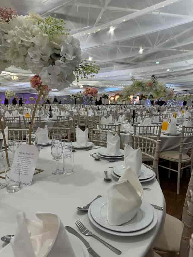 Elegant Byron Hall ballroom gala setup with floral centerpieces for corporate and social events.