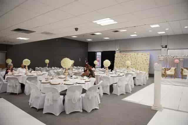Elegant event venue with floral centerpieces for weddings and formal gatherings.