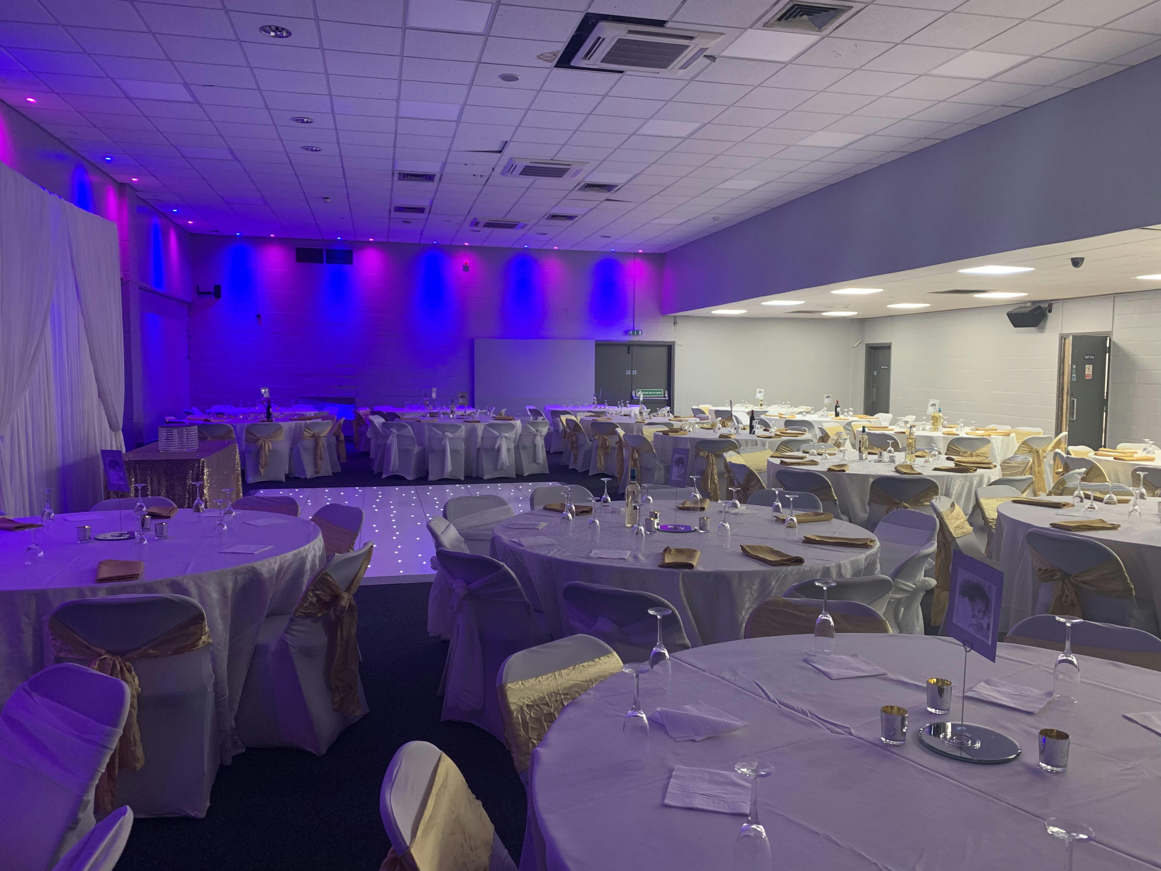 Elegant Masefield Suite venue with draped tables, perfect for weddings and corporate events.