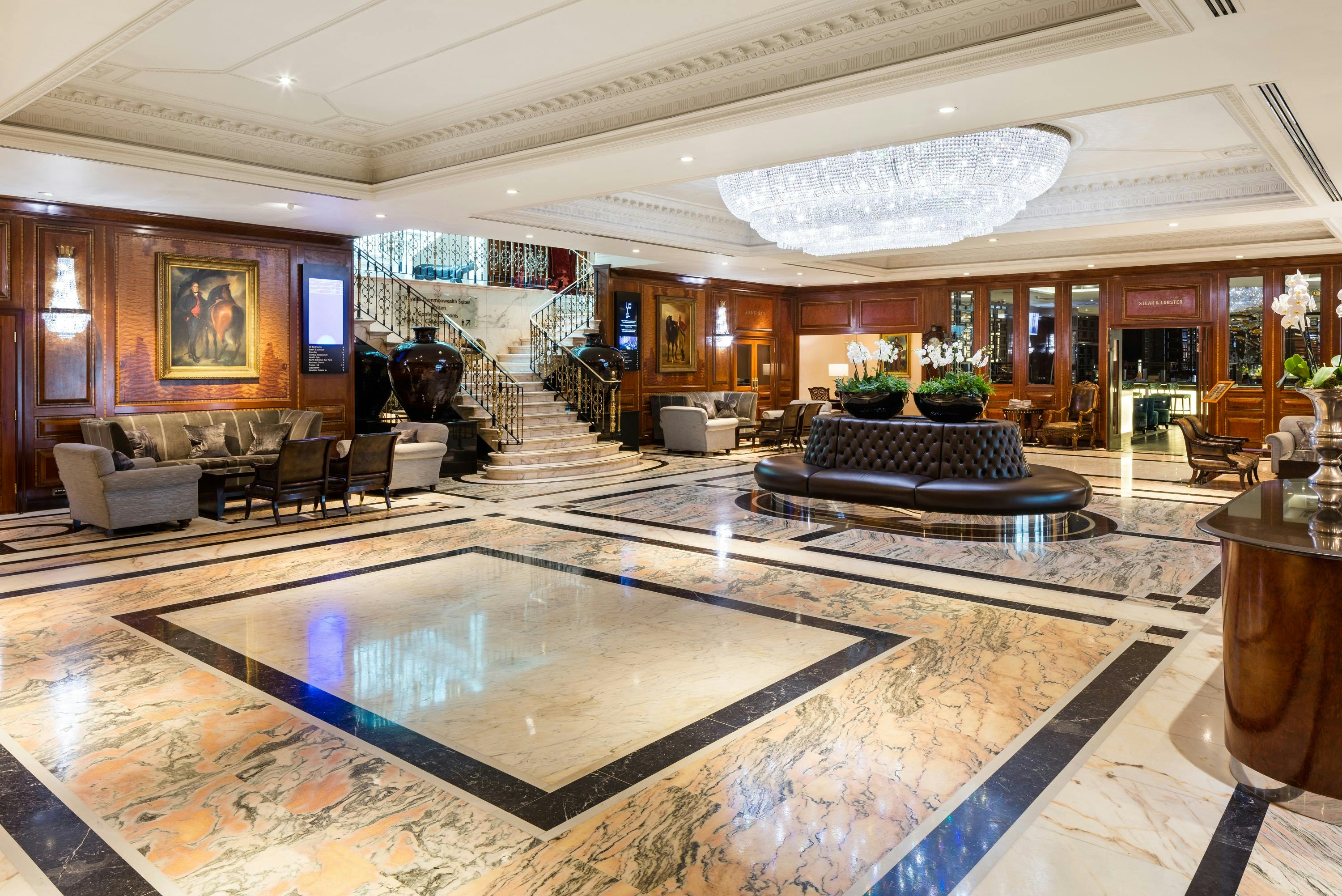 Luxurious hotel lobby at Radisson Blu Heathrow with elegant marble flooring, ideal for events.
