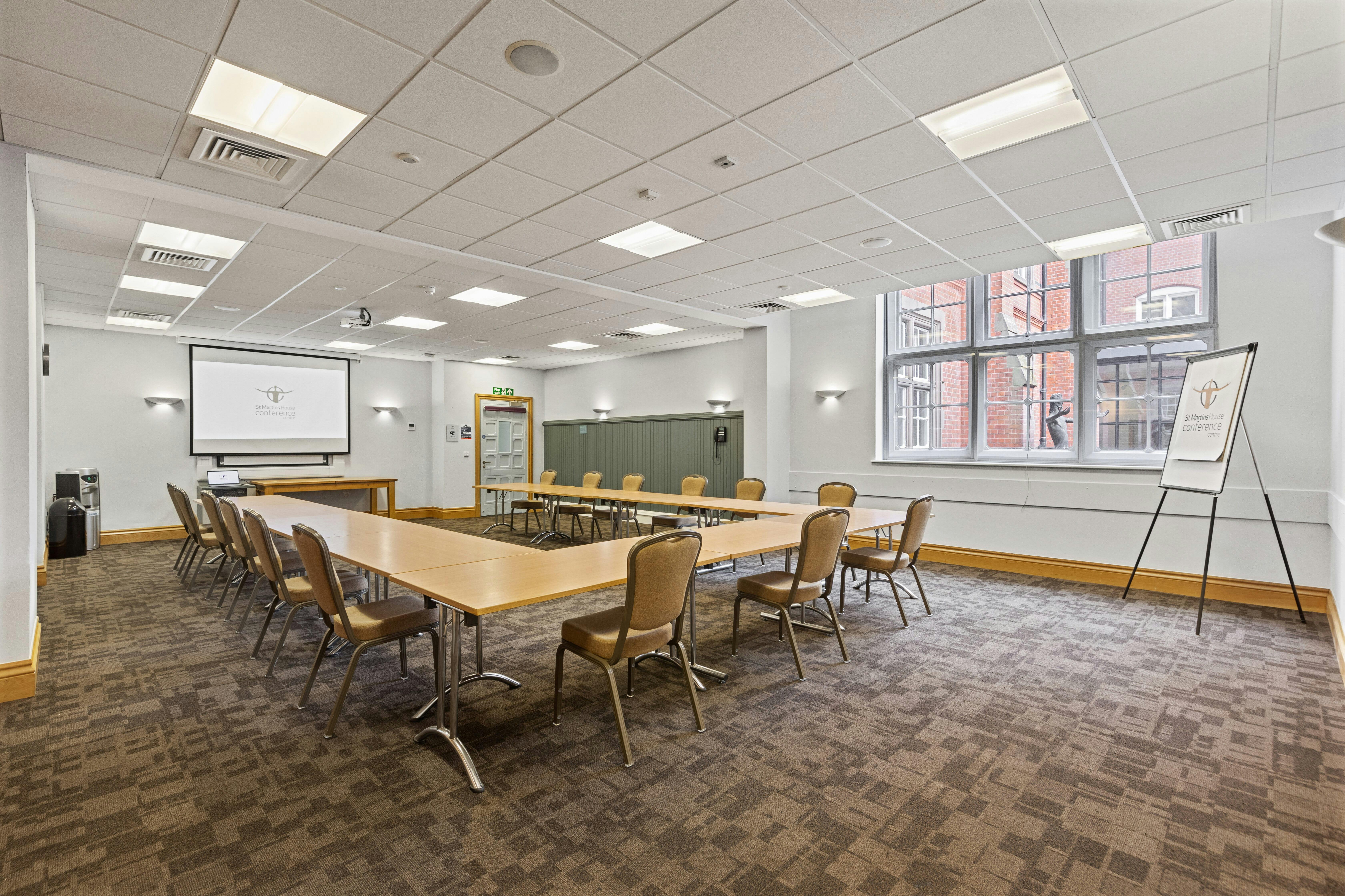 Kempe Room at St Martins House: modern meeting space with large windows for events.