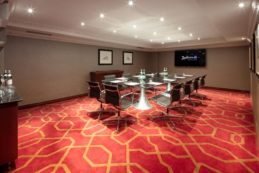 Modern meeting room at Radisson Blu Heathrow, ideal for professional events and presentations.