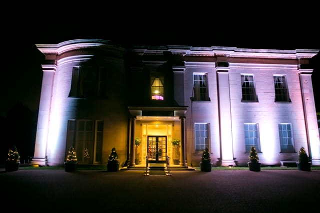 Elegant venue with strategic lighting, perfect for upscale receptions and gala dinners.