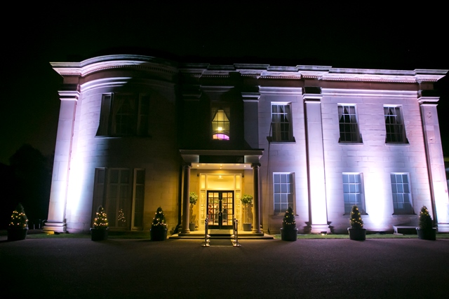Elegant venue with strategic lighting, perfect for upscale receptions and gala dinners. - Banner