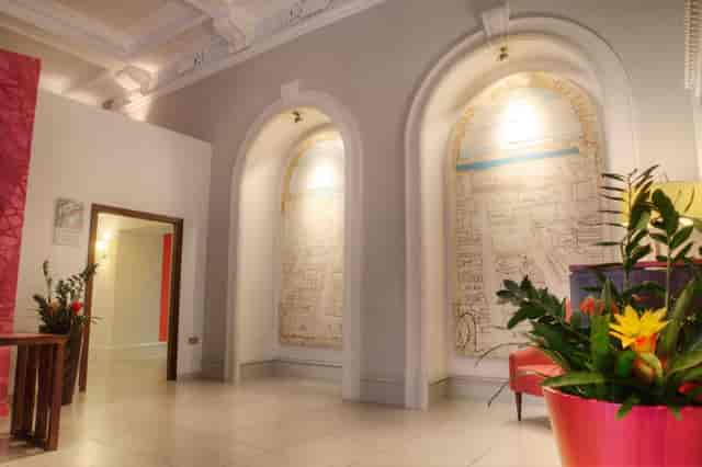 Elegant Lounge Bar at Hotel Indigo Glasgow with arched niches, ideal for events and networking.