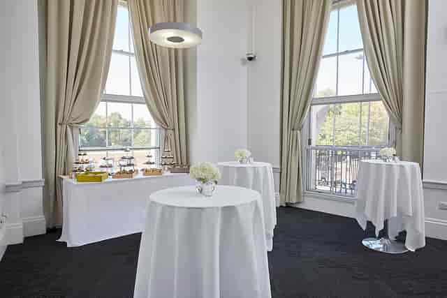 Elegant event space with high-top tables, ideal for networking and cocktail receptions.