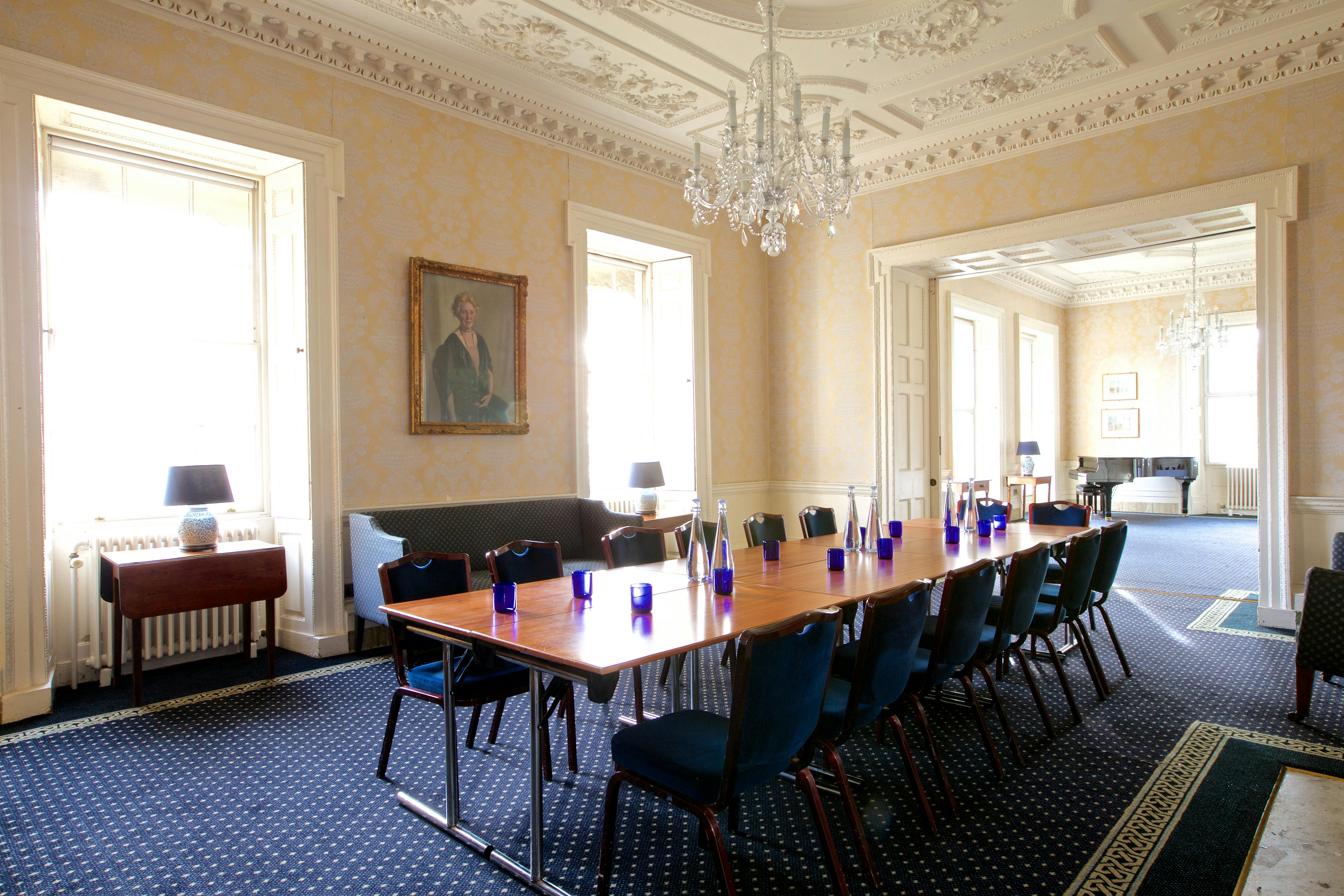 Elegant meeting room at Clifton Hill House with chandelier, ideal for small events.