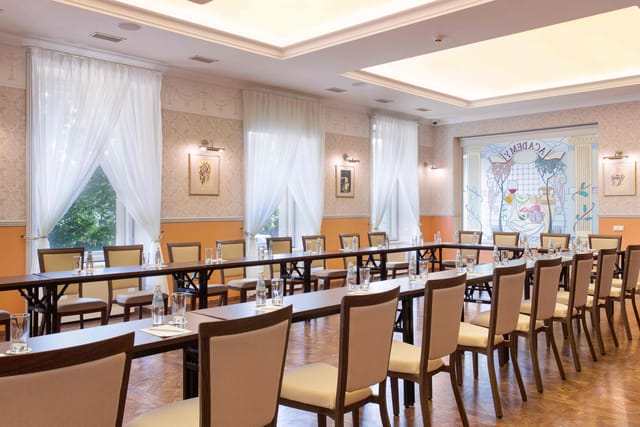Meeting room at Radisson Hotel Riga with U-shaped tables for corporate events.