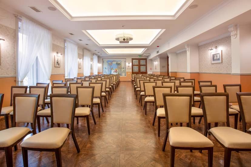 Meeting space at Radisson Hotel Riga with beige chairs for presentations and workshops.