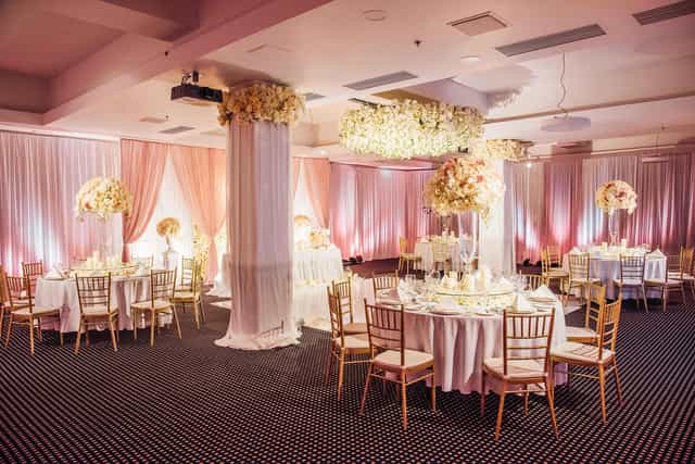Elegant Daugava Ballroom with round tables, perfect for weddings and corporate events.