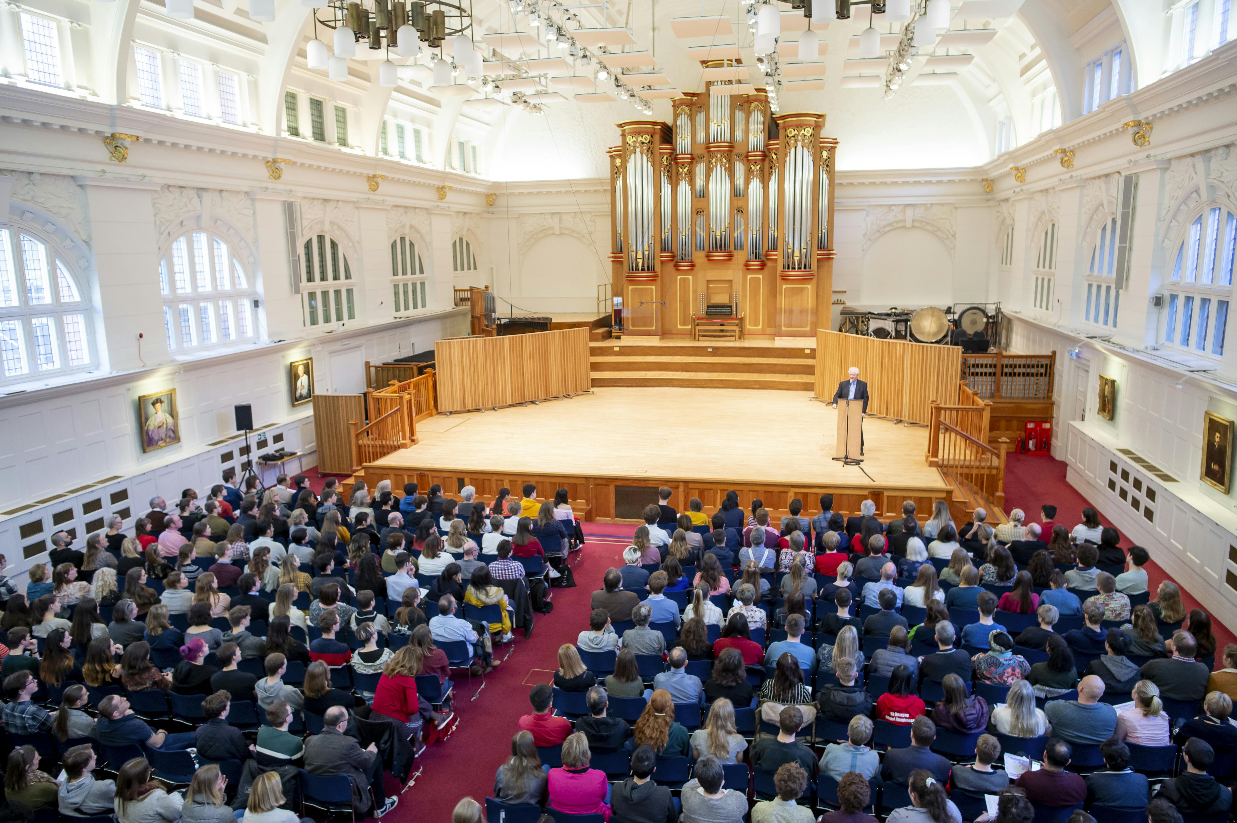 Amaryllis Fleming Concert Hall seminar with impressive organ backdrop and tiered seating.