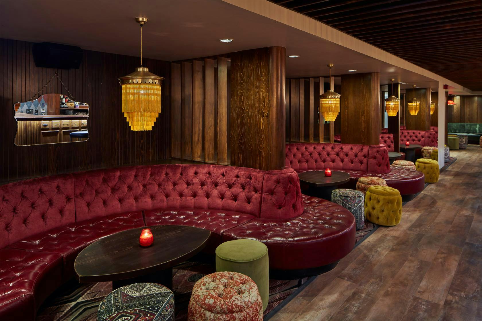 Main Hall Exclusive lounge with plush red seating for networking events and gatherings.