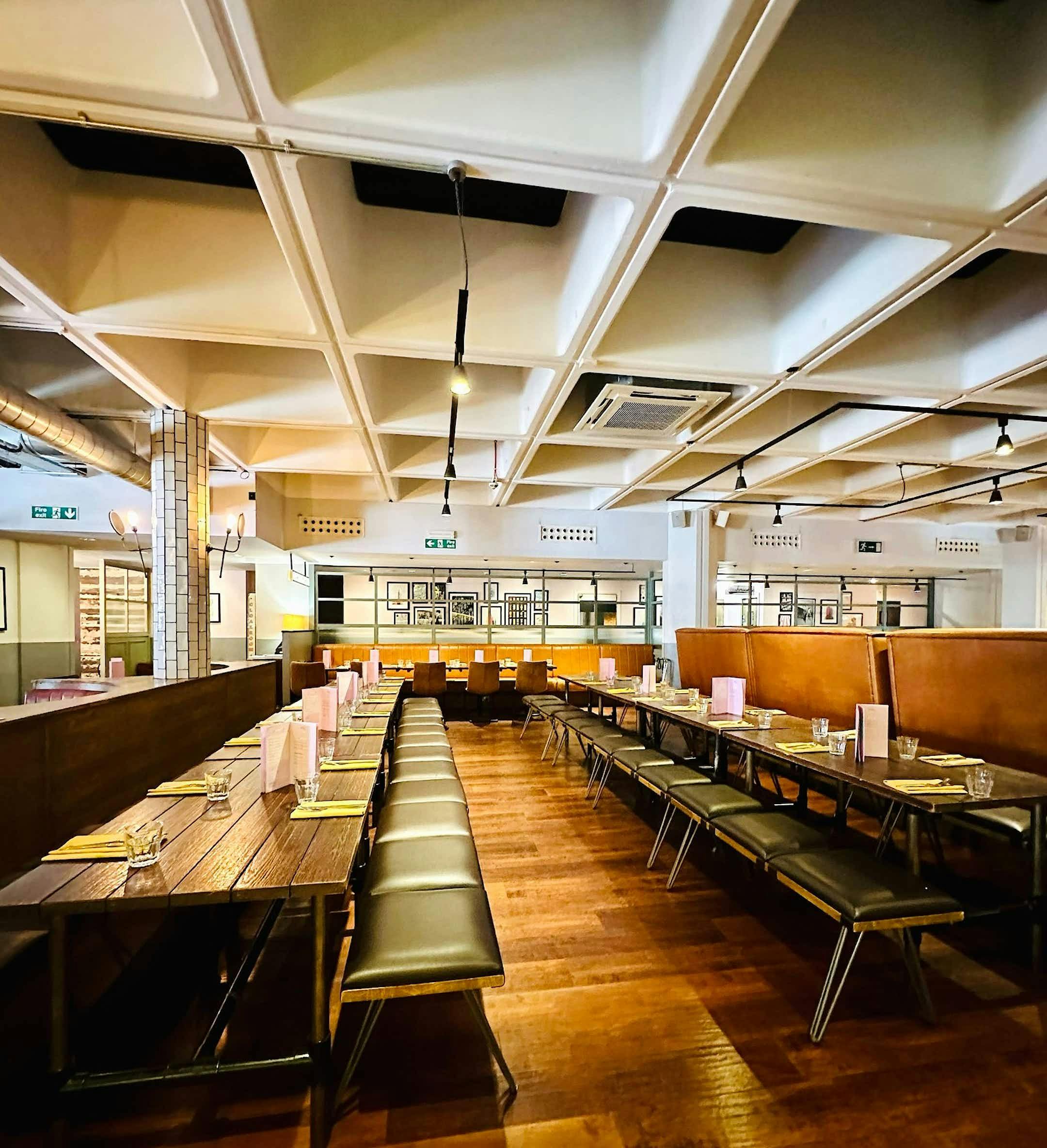 Spacious Main Hall at All Star Lanes, ideal for corporate events and social gatherings.