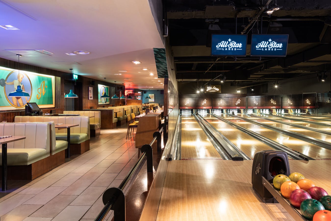 Vibrant bowling alley venue for corporate events with modern design and ample lanes.