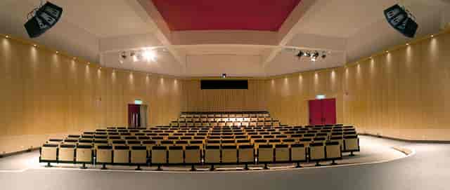 Auditorium at Fundació Joan Miró with tiered seating for conferences and presentations.