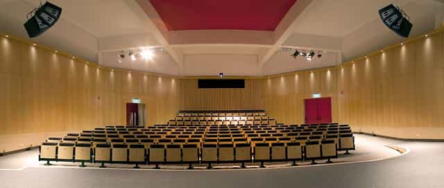 Auditorium at Fundació Joan Miró with tiered seating for conferences and presentations.