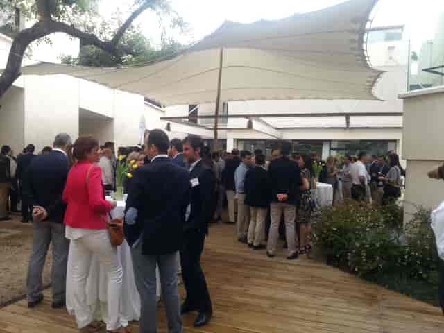 Carob Tree Patio networking event with high-top tables and elegant canopy in Fundació Joan Miró.