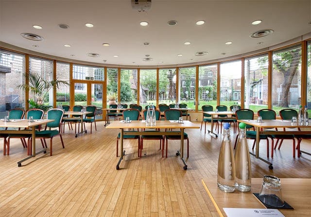 Queen Elizabeth Conference room with large windows, ideal for workshops and meetings.