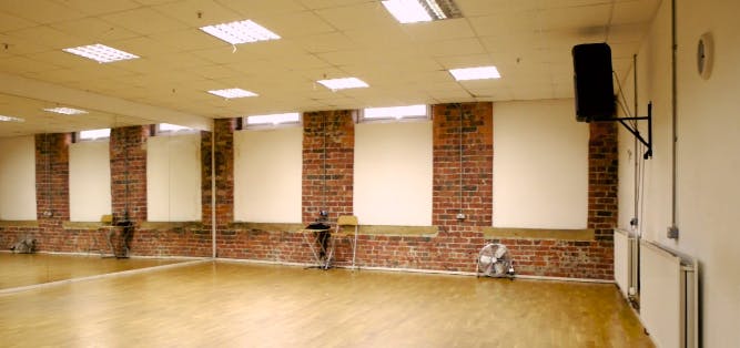 Dance Studio 3 with wooden flooring, ideal for workshops and performances in Leeds.