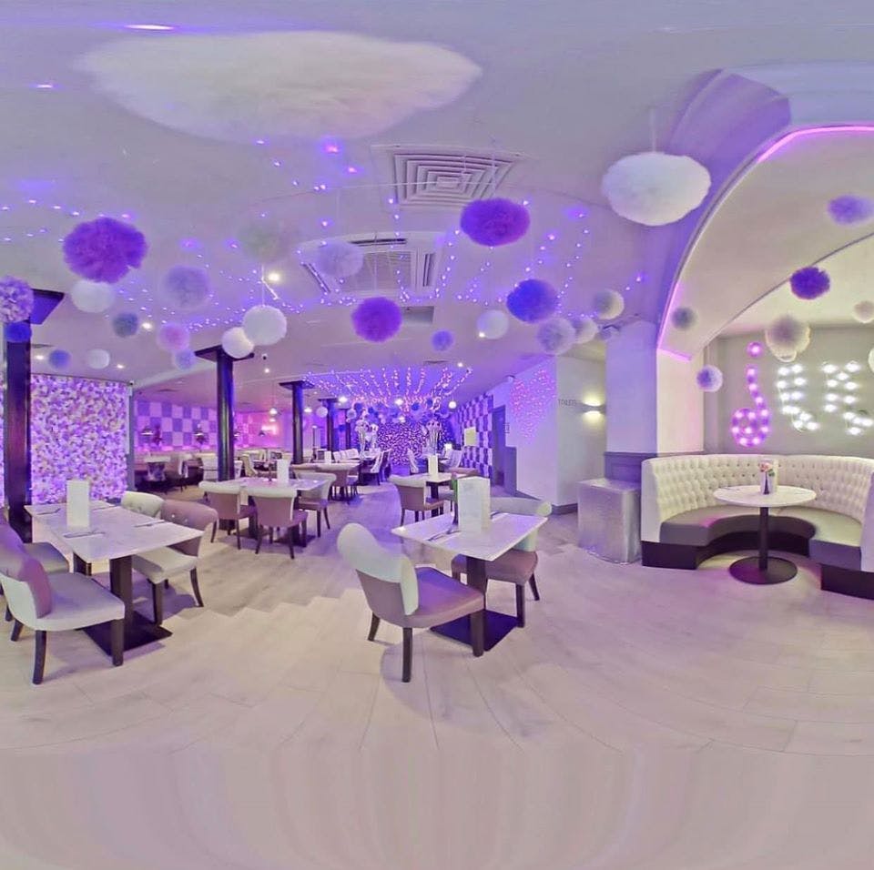 Vibrant Jam restaurant event space with purple lighting for stylish gatherings.