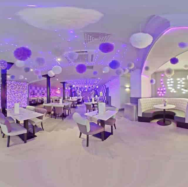 Vibrant Jam restaurant event space with purple lighting for stylish gatherings and receptions.