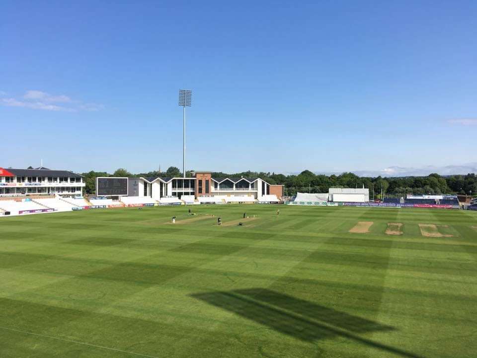 Riverside Suite cricket ground with green field, ideal for corporate events and sports gatherings.