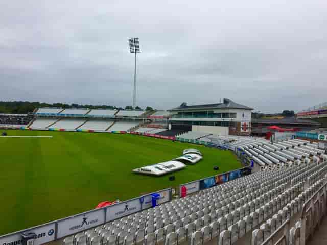 Riverside Suite sports venue with green field and tiered seating for large events.