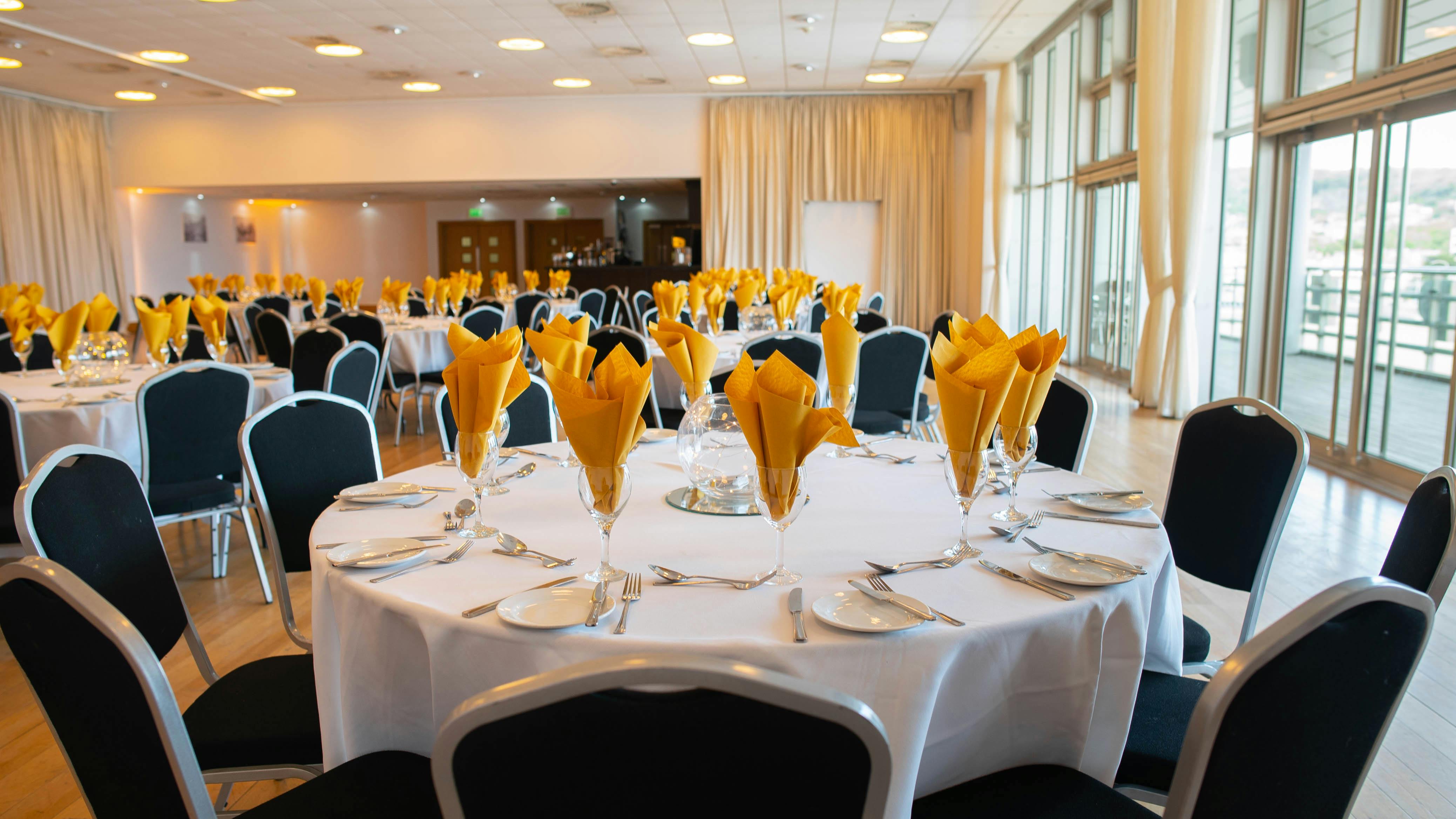 Regency Suite banquet setup with elegant tables, ideal for corporate events and celebrations.