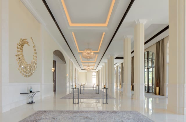 Regal Ballroom corridor at St. Regis Saadiyat Resort, ideal for elegant events and conferences.