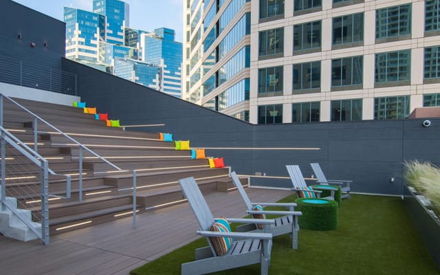Outdoor event space with tiered seating, ideal for networking and team-building activities.