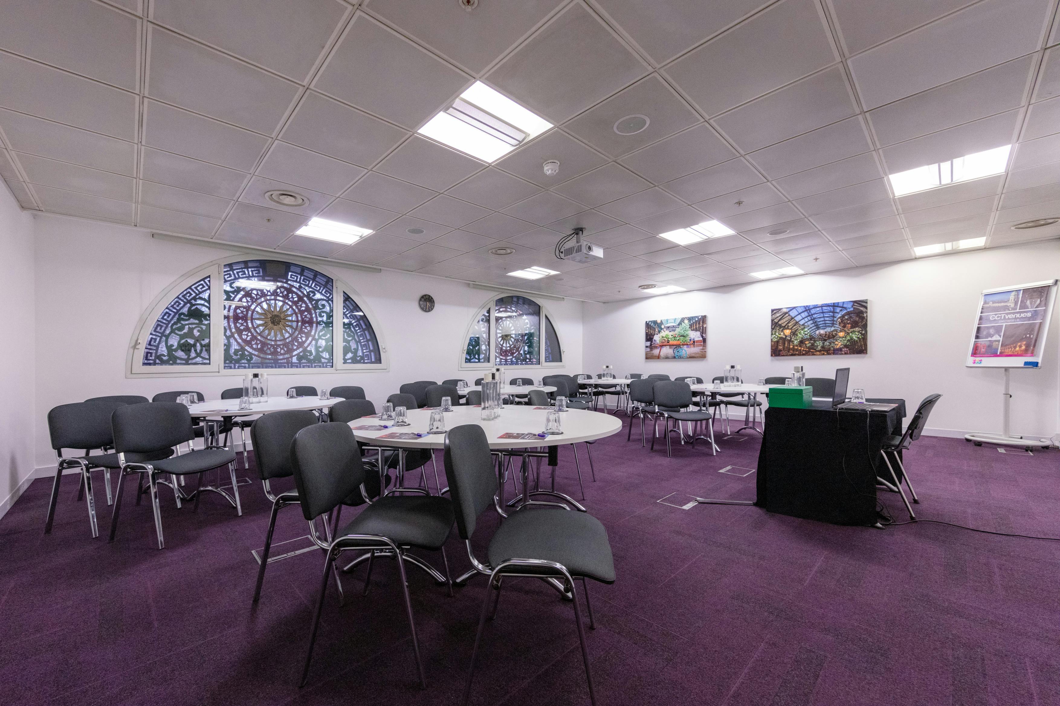 Covent Garden meeting space with stained glass, ideal for events and presentations.