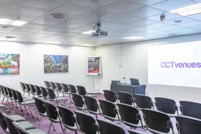Covent Garden meeting room with projector screen, perfect for corporate events and training.
